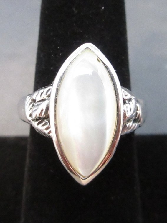 Unmarked silver color ring with white opal stone