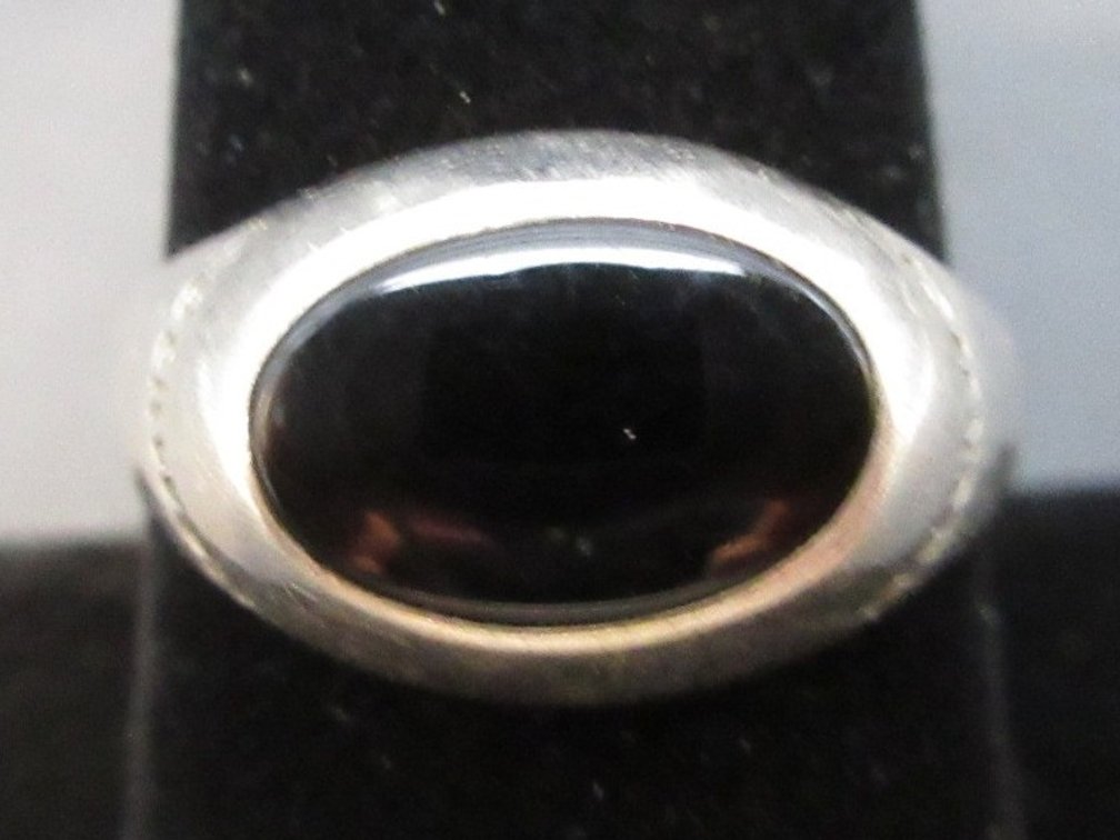 Marked "Tiffany & Co." Sterling ring with "Rockwell" black onyx ring