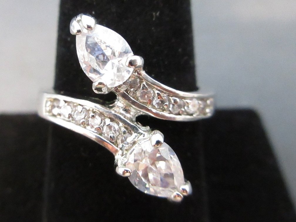 Marked "GR" silver color ring with CZ pear shaped stones
