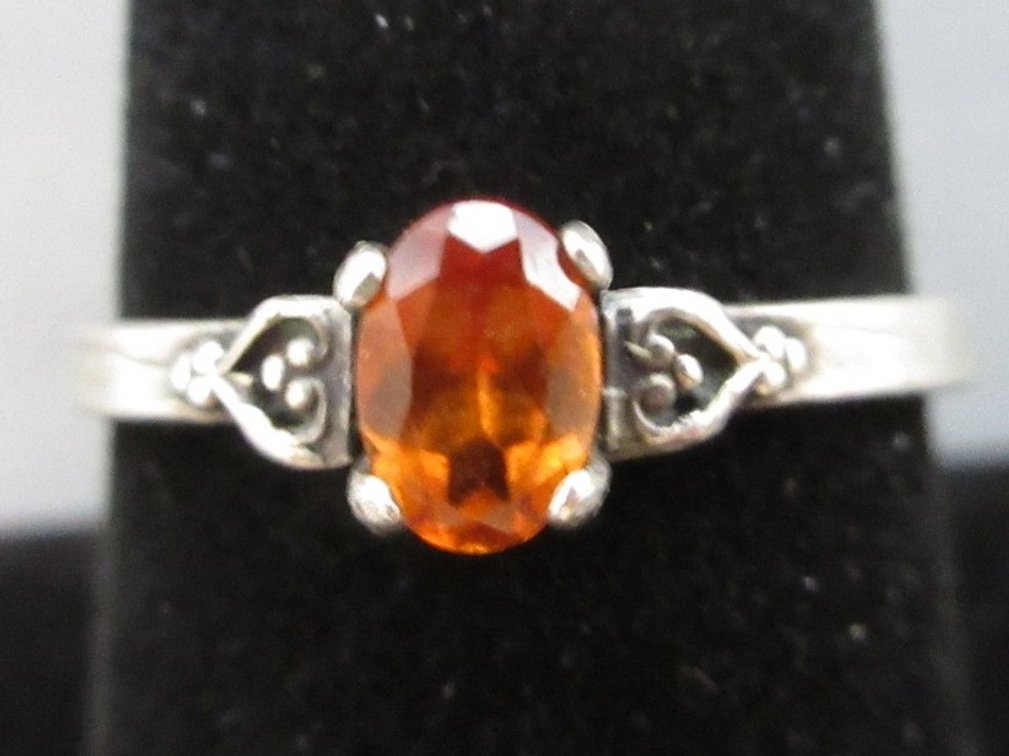Unmarked silver color ring with topaz stone