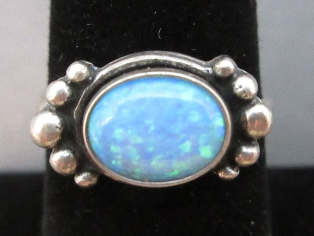 Marked .925 silver and opal ring