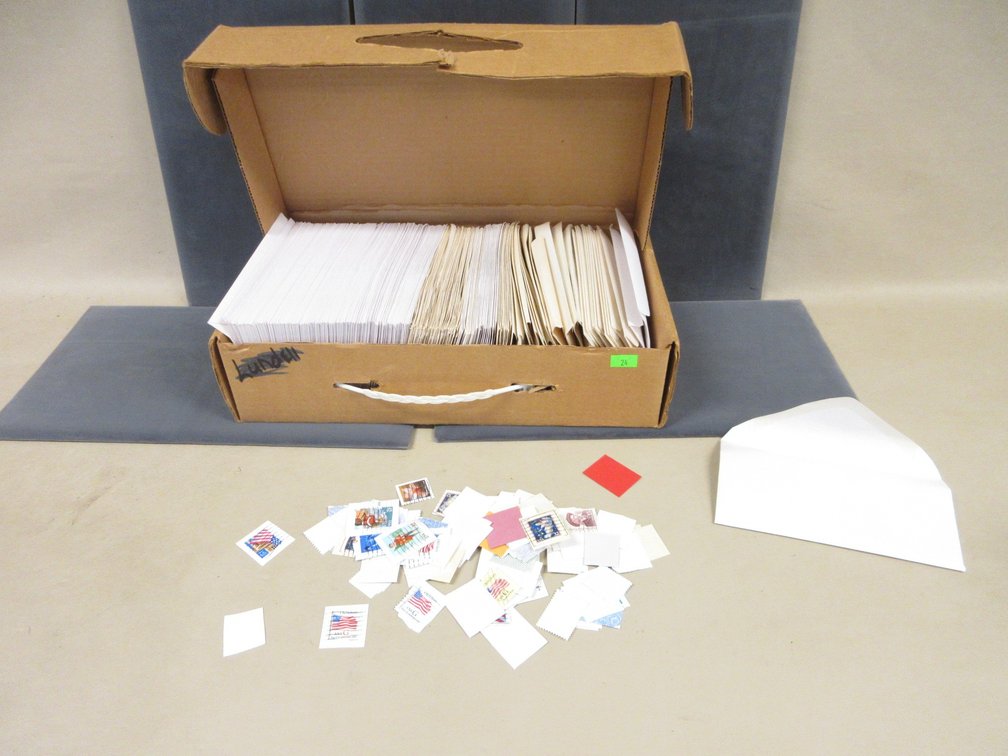 Box of envelopes of assorted cancelled stamps
