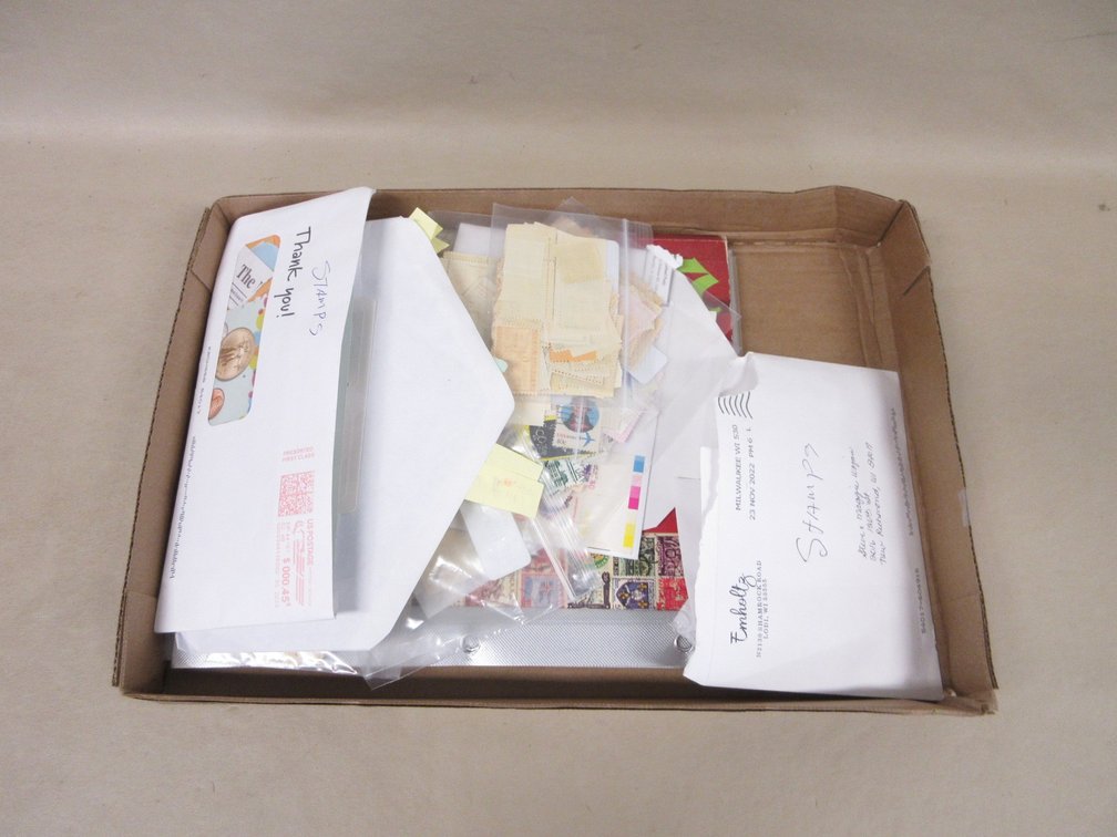 Flat of collected postage stamps