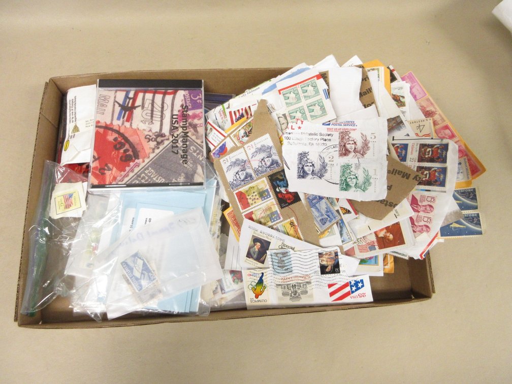 Flat of collected postage stamps