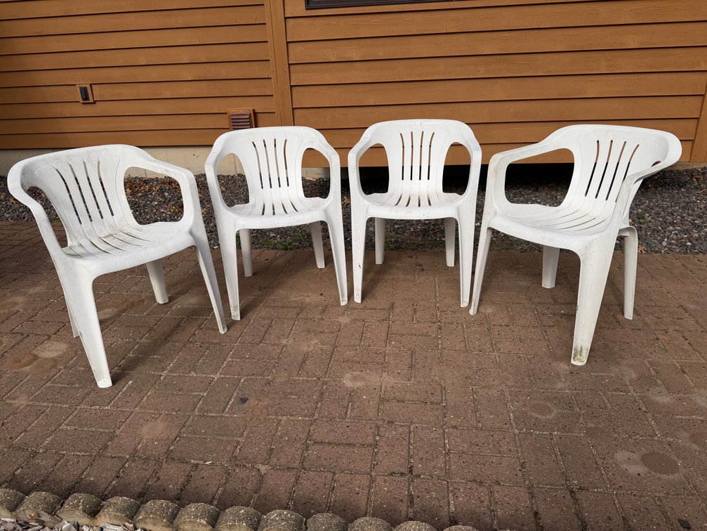 Set of (4) plastic patio chairs