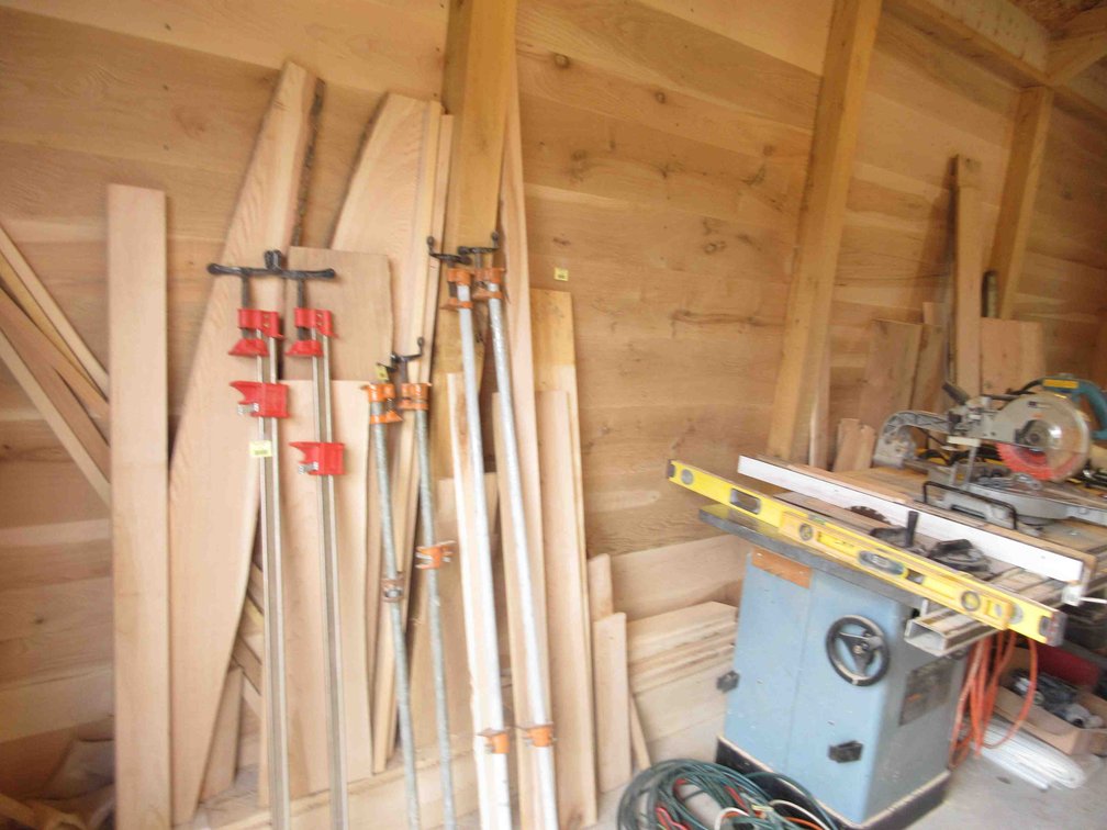 Group of lumber along wall