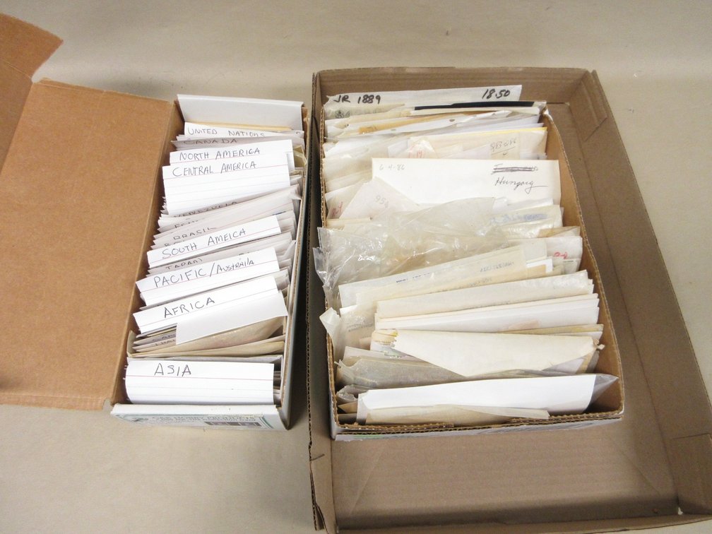 Flat of collected postage stamps