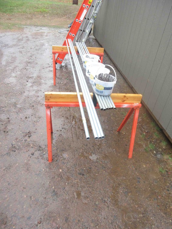 Group of 3/4" conduit and metal saw horses