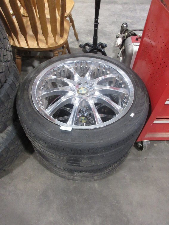 (2) BMW tires on chrome rims