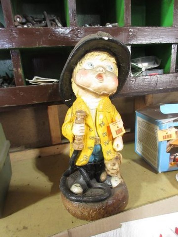 Plaster fireman statue
