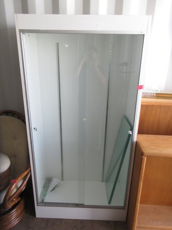 Show case with glass shelves