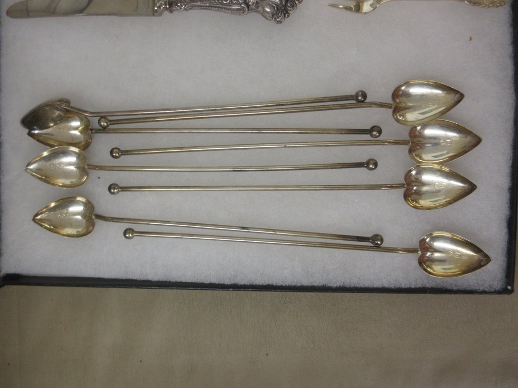 (8) Hallmarked sterling heat-shaped ice tea spoons