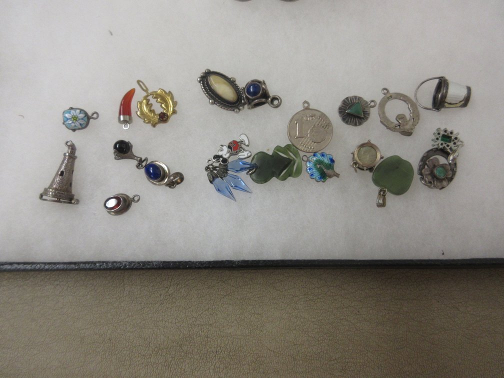 (21) Charms or pendants, including sterling silver