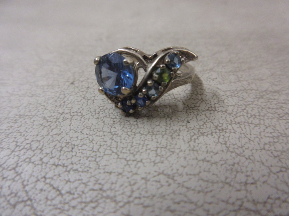 Marked Sterling gold-toned ring with blue and green stones