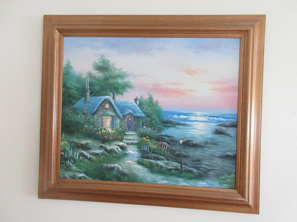 Seaside cottage painting on canvas in frame