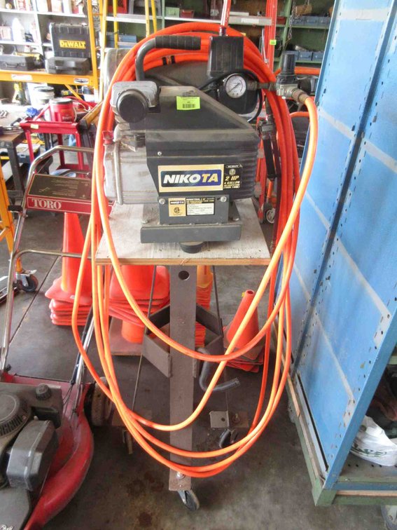 Nikota air compressor on rolling stand
