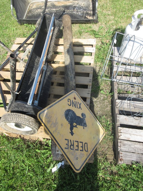 "DEERE XING" sign on post