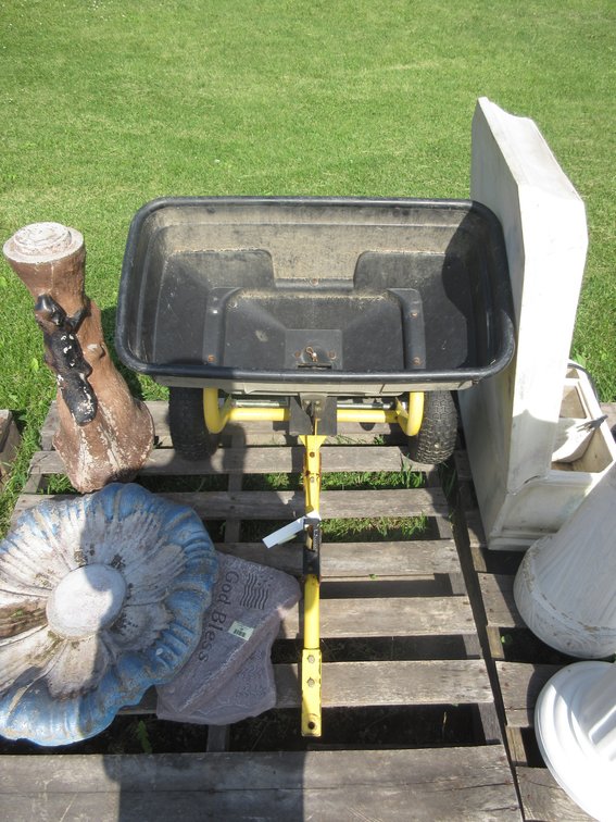 Pull behind lawn spreader