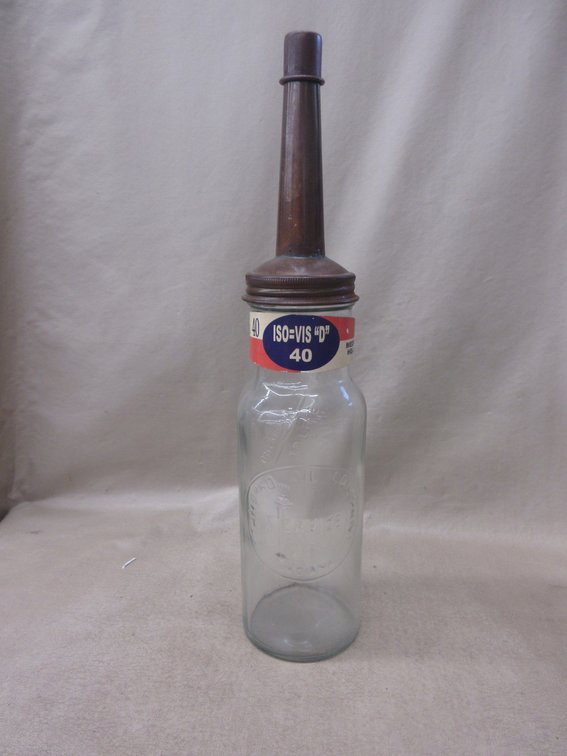 Standard Service quart oil bottle with paper label and metal spout