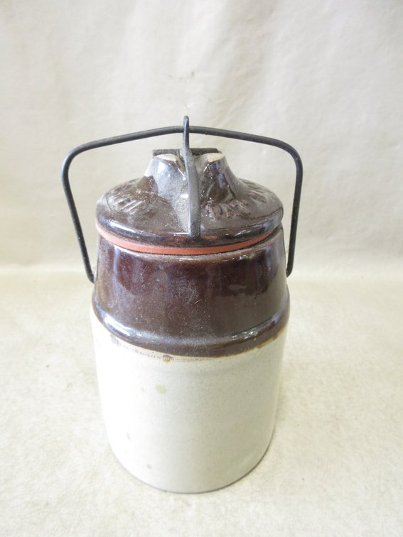 Unmarked stoneware caning jar with lid and wire bail closure
