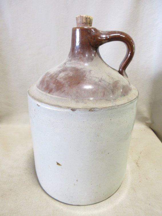 Unmarked stoneware jug with brown top glaze
