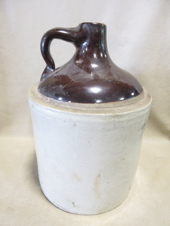 Stoneware shoulder jug with Albany slip top