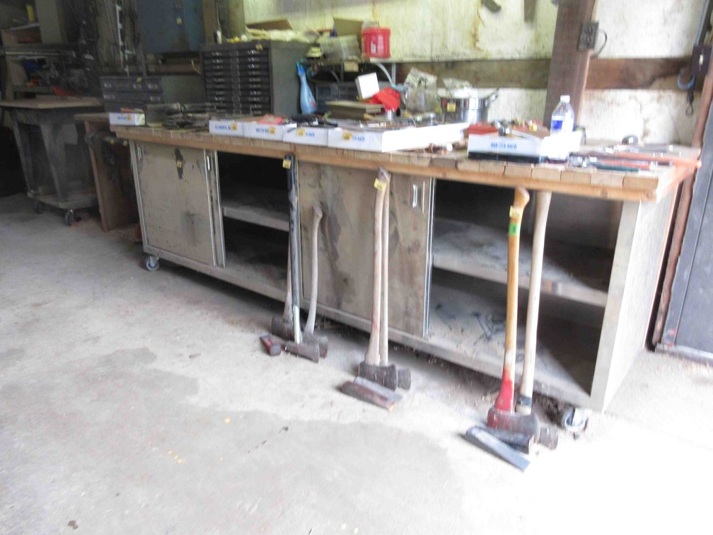 Large rolling metal workbench with wood top
