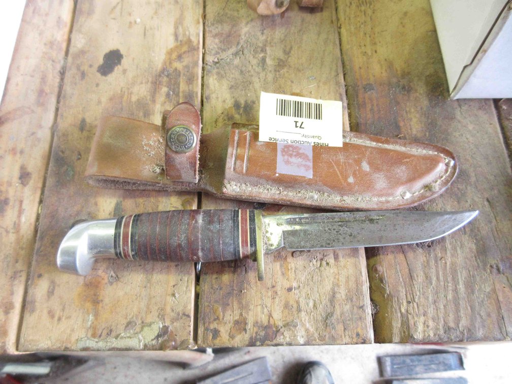 Western knife in leather sheath