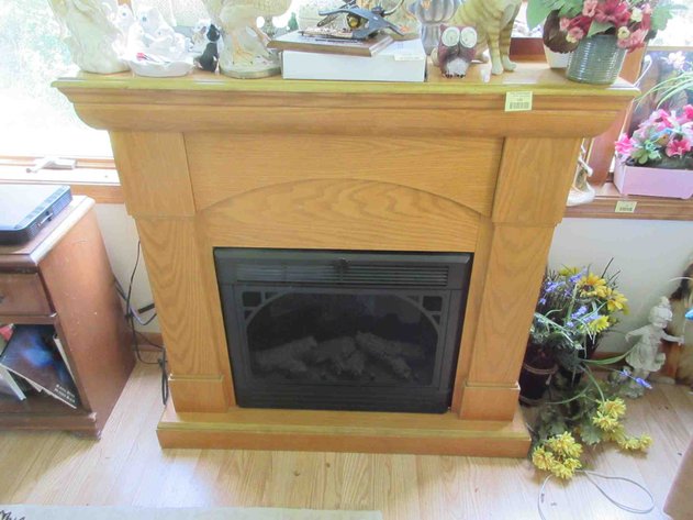 Image for Electric fireplace in pressed wood oak surround