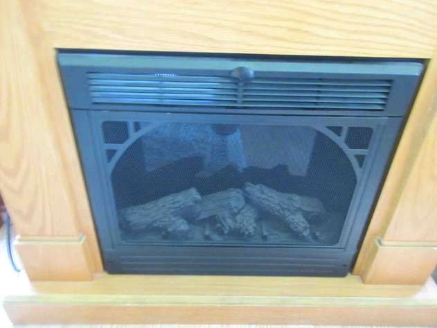 Image for Electric fireplace in pressed wood oak surround
