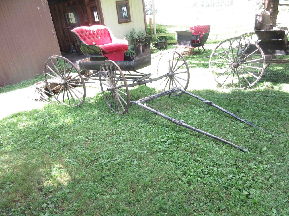 Antique single seat buggy with single horse pole