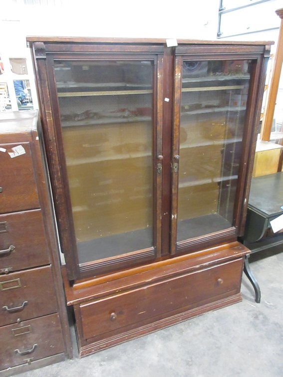 Antique wood cabinet with large front drawer