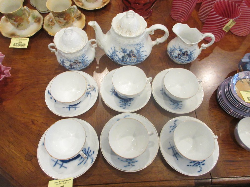 Antique flow blue tea service with gold detail