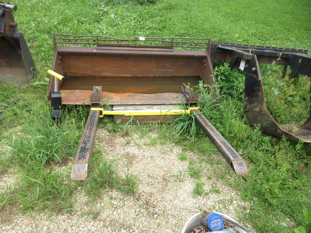 Skid Steer bucket with clamp on fork tines