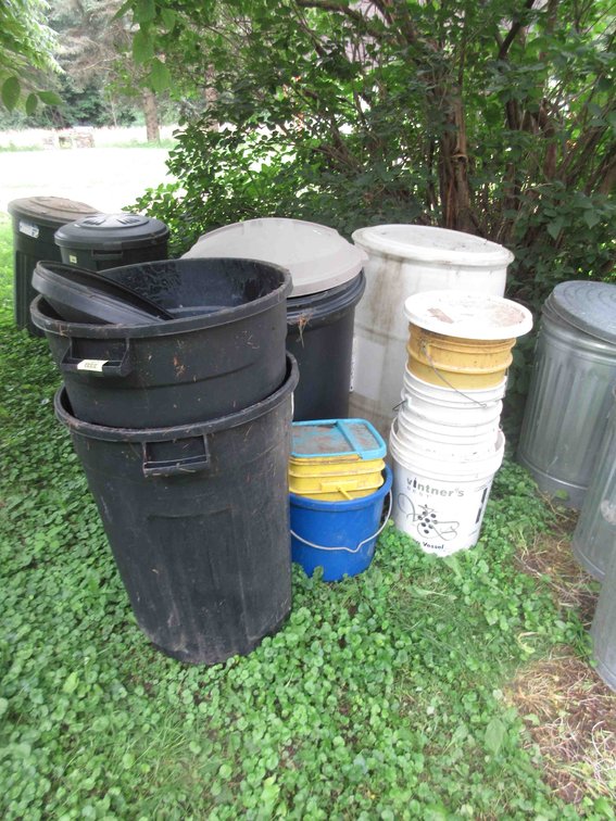 Group of plastic garbage cans, barrel and pails