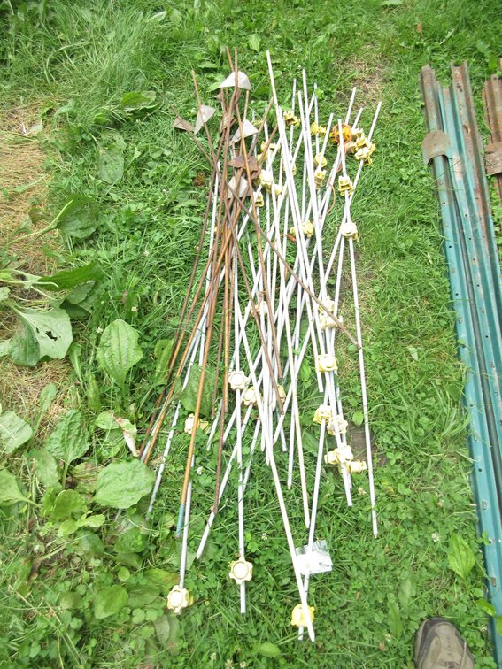 Group of fiberglass and steel electric fence posts