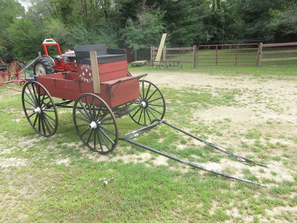 Antique wood buckboard wagon with single horse pull