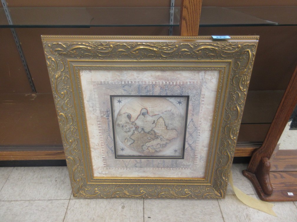 Ornately framed Old World map print