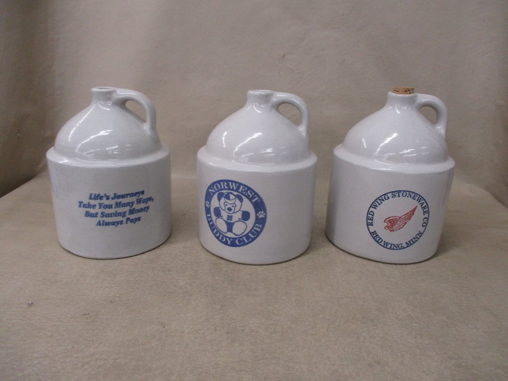 (3) Stoneware advertising bank jugs
