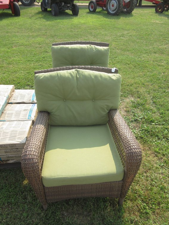 (2) Plastic wicker patio chairs with cushions