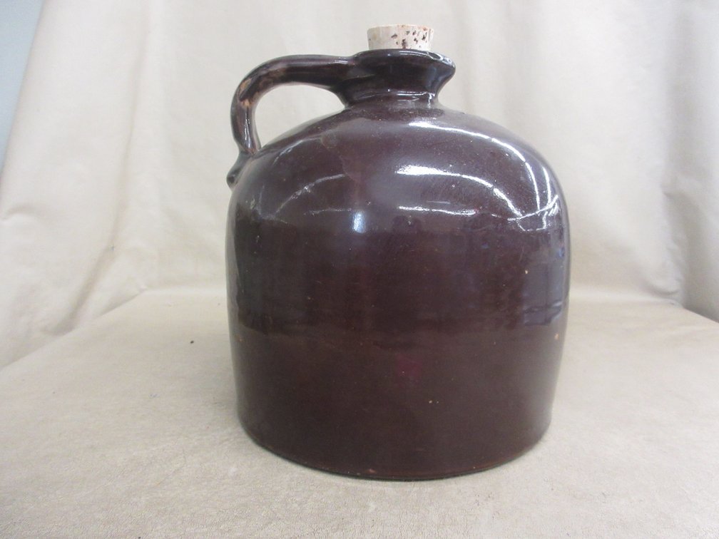 Brown glazed stoneware shoulder jug  with spout