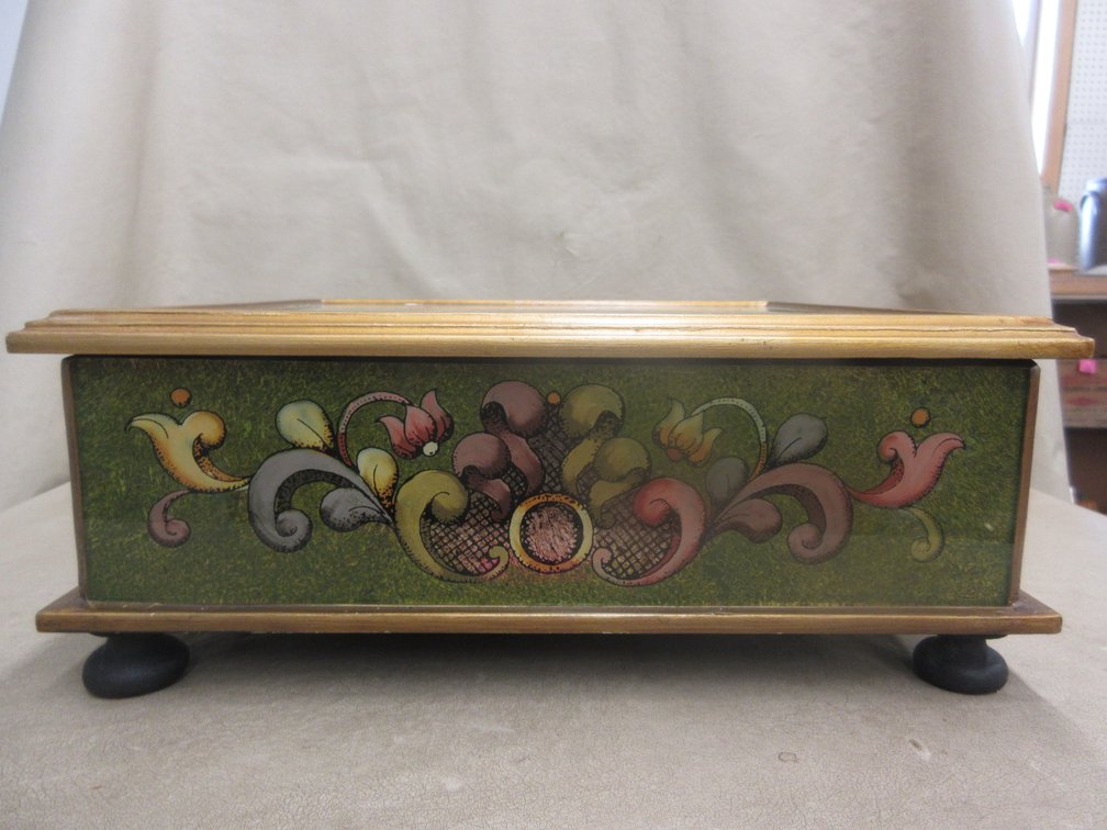 Ornate designed wooden box with lid