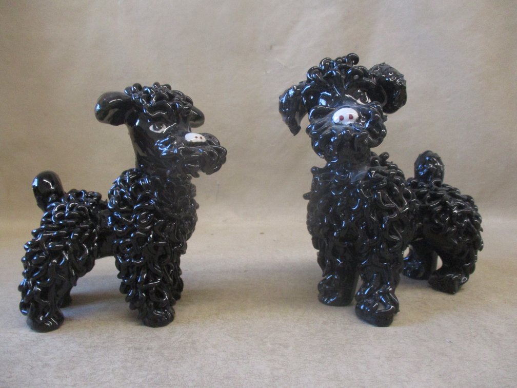 (2) Black ceramic noodle poodles figures