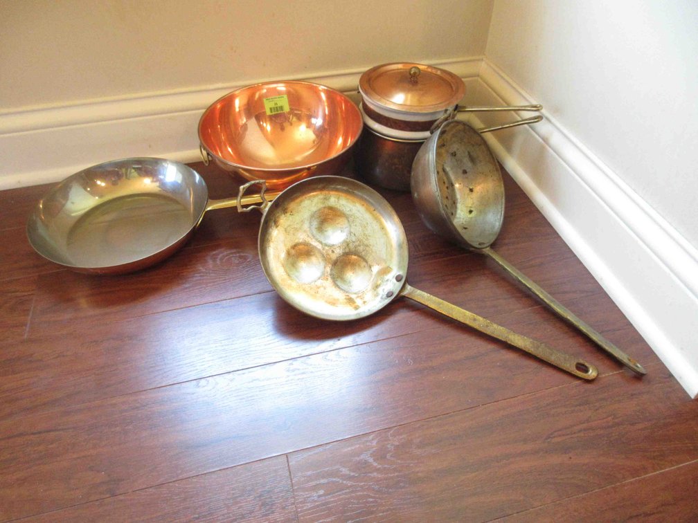 Group of copper pots and pans