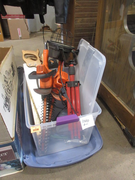 Tote of yard and garage tools
