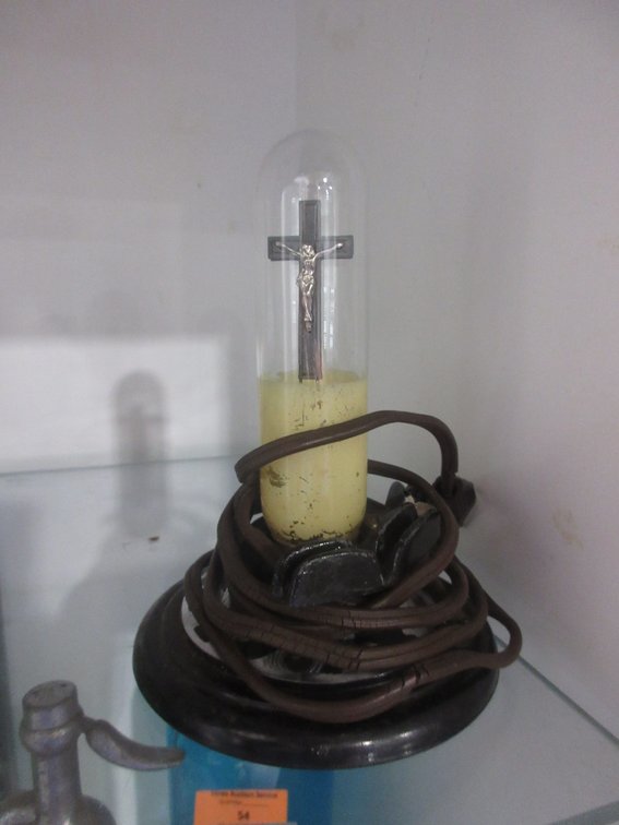 Vintage electric bulb with crucifix inside