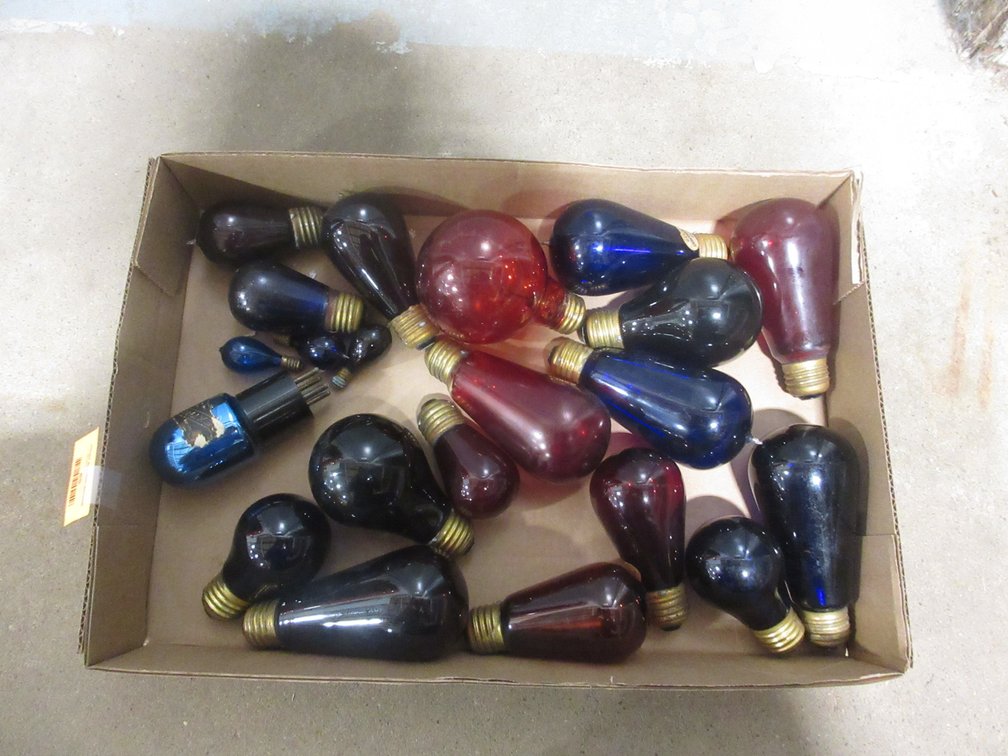 Box of vintage colored electric light bulbs
