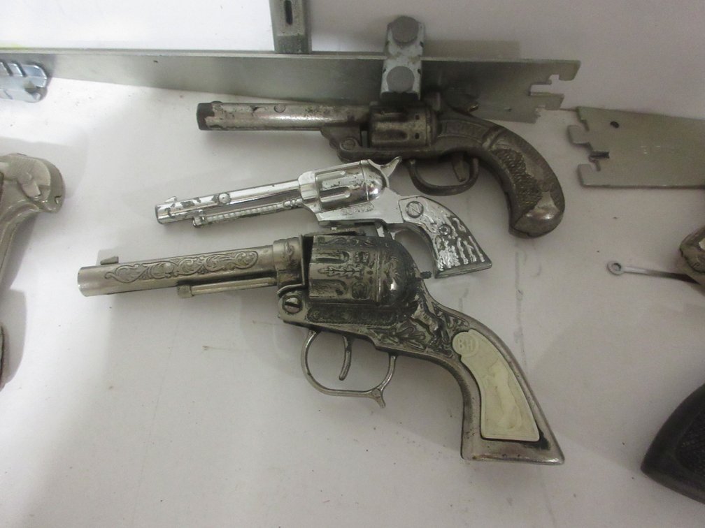 (3) Toy cap guns and (1) plastic holster belt