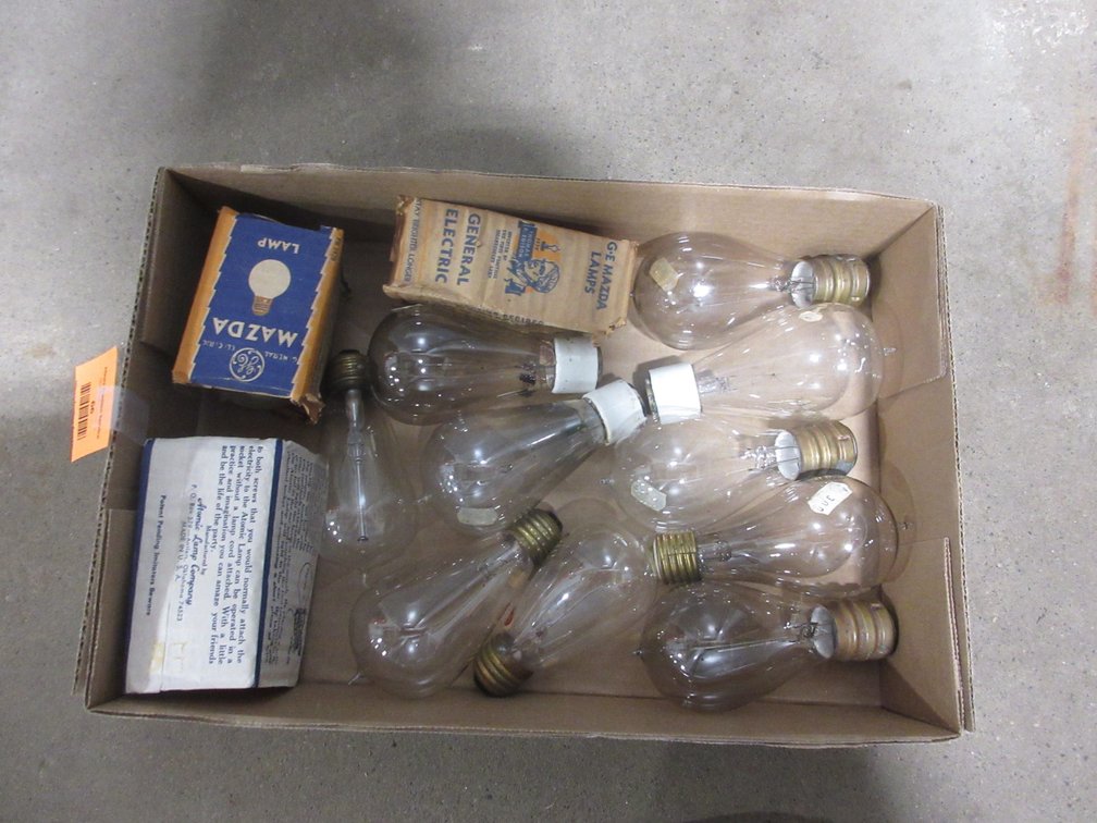 Box of vintage light bulbs including porcelain socket