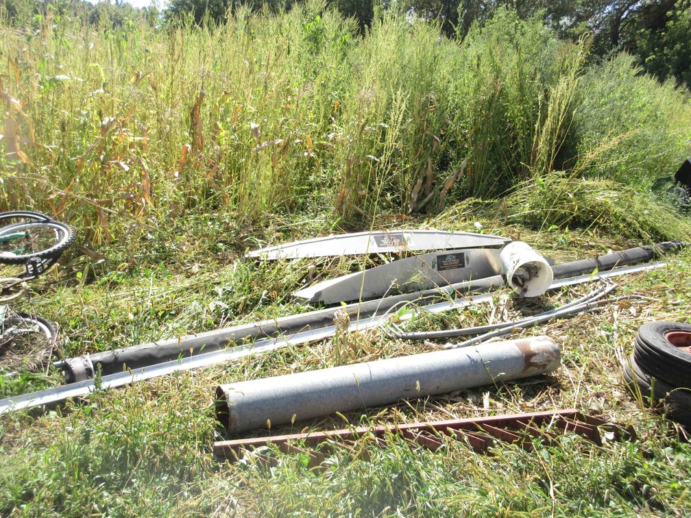 Group of scrap iron along field
